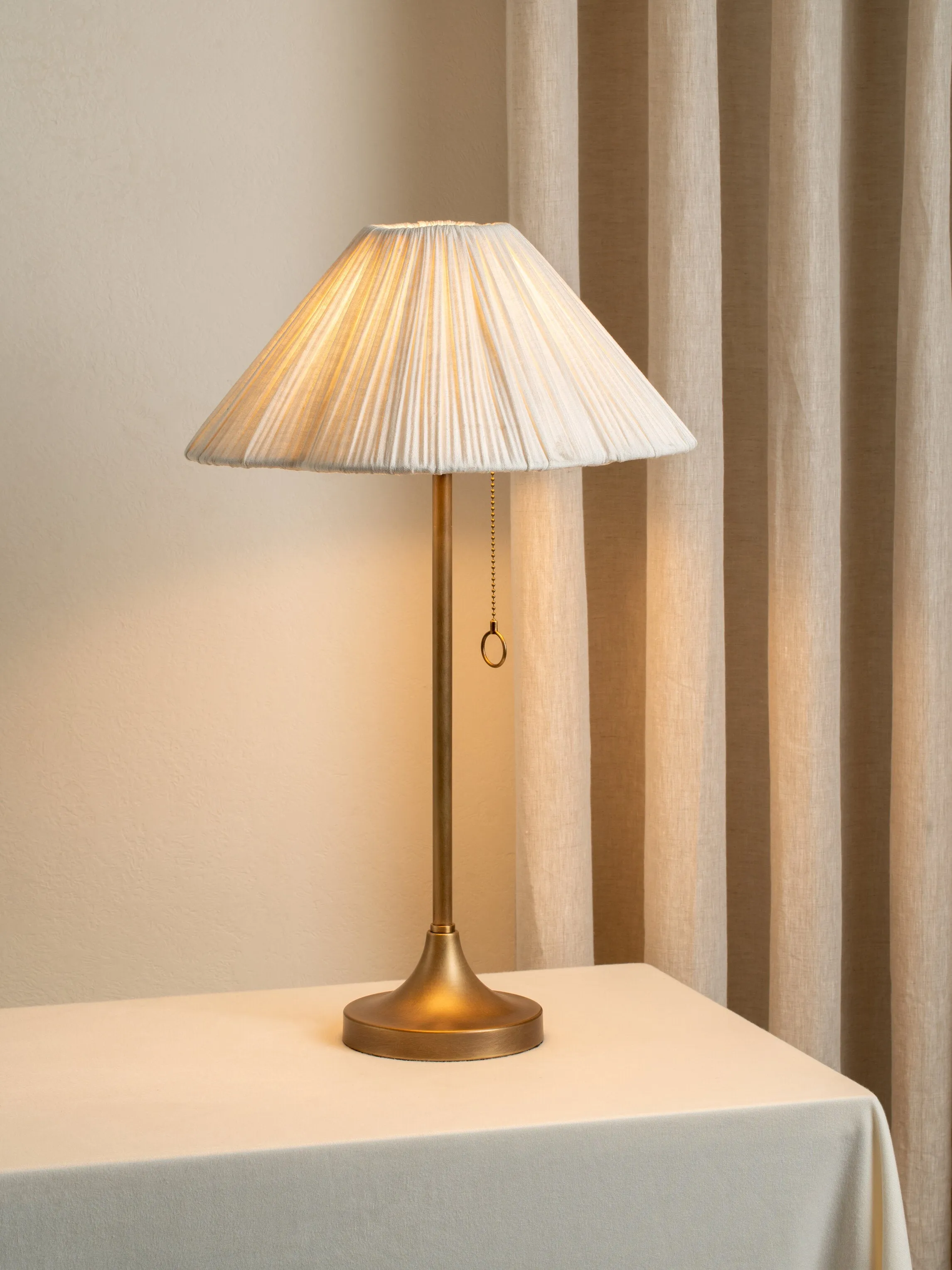 Lindi - aged brass and scalloped linen table lamp