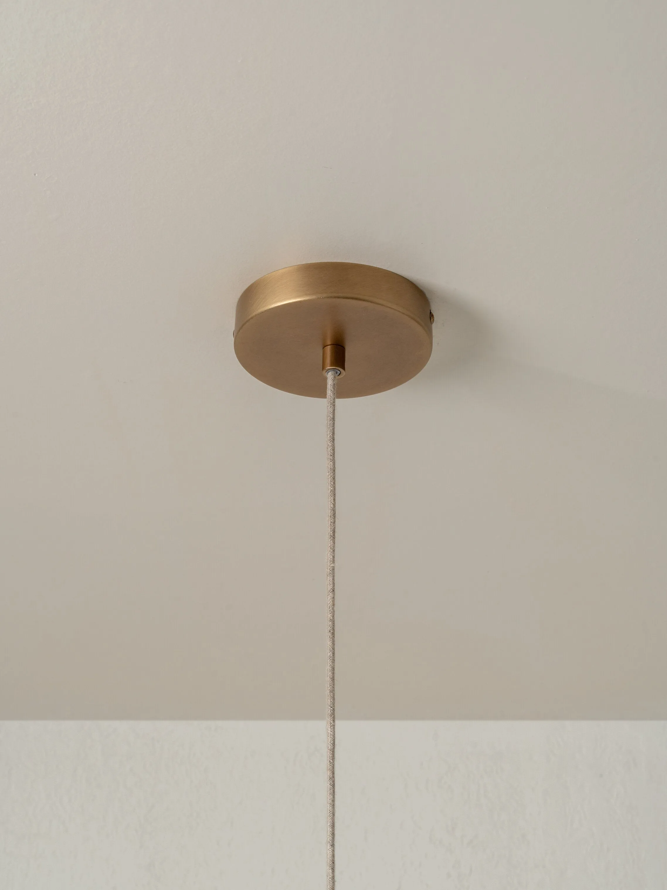 Lindi - small aged brass and linen scalloped pendant